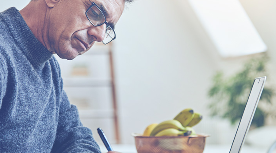 A guy writing down some notes