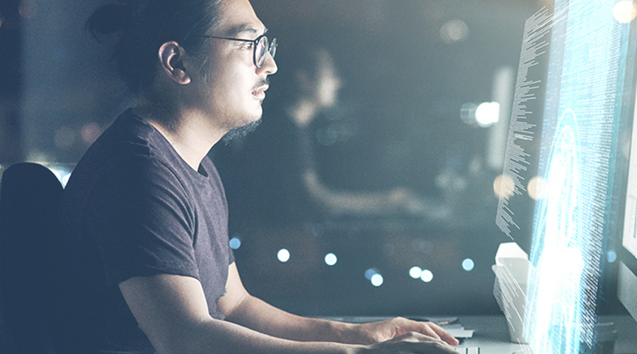A man looking at the computer